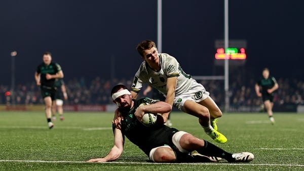 Paul Boyle of Connacht scores a try despite the attention of Jean Seux of Montauban during the EPCR Challenge Cup match between Connacht and US Montauban at Dexcom Stadium in Galway