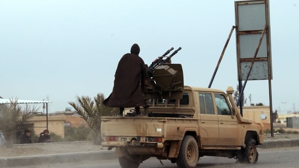 A person sits in a truck 