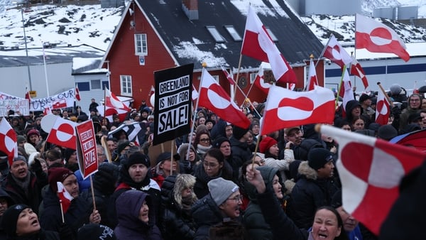 People bear Greenlandic flags as they gather in front of the US consulate protest against Donald Trump and his announced intent to acquire Greenland