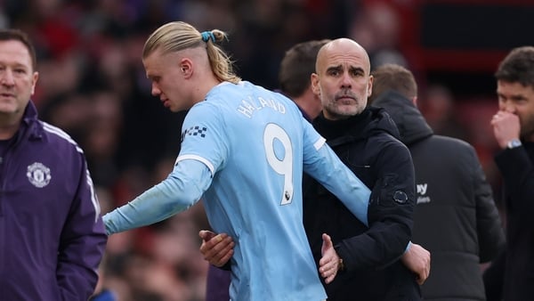 MANCHESTER, ENGLAND - JANUARY 17: Pep Guardiola embraces Erling Haaland of Manchester City during the Premier League match between Manchester United and Manchester City at Old Trafford on January 17, 2026 in Manchester, England. (Photo by Carl Recine/Gett