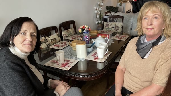 Jean Cosgrove and Helen Broad sitting at a kitchen table