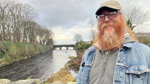 Richard Hodgen standing in front of a river