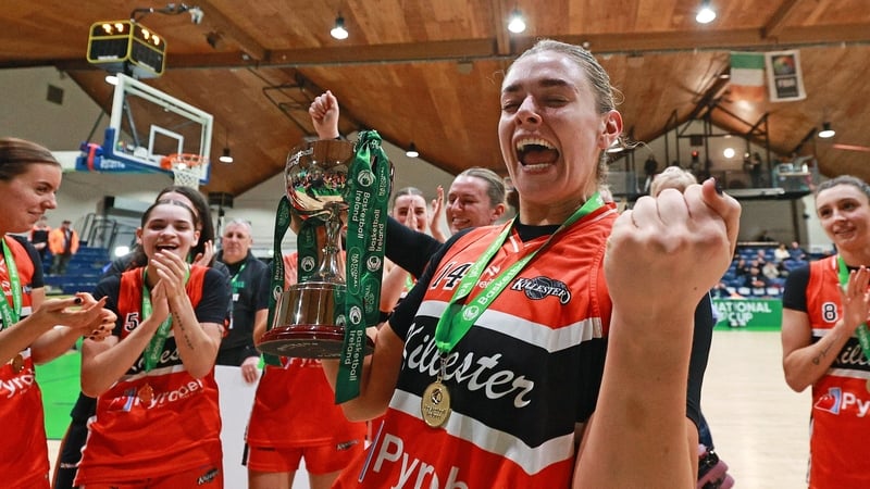Hannah Thornton of Killester celebrates with the cup