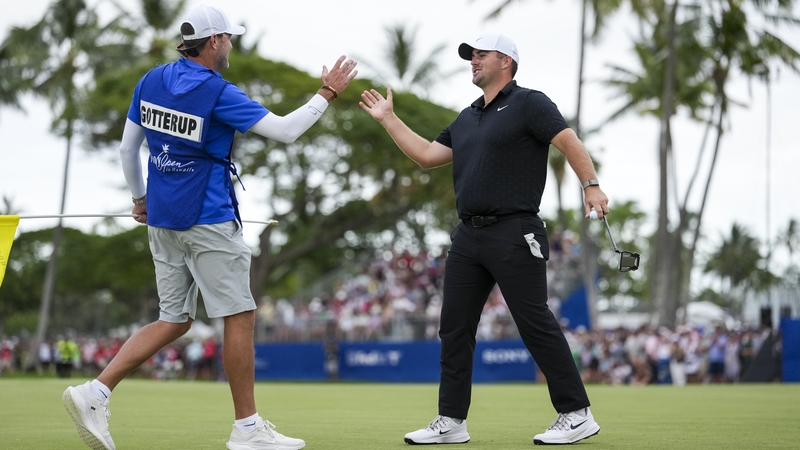 Chris Gotterup celebrates with his caddie Brady Stockton on the 18th green upon winning the Sony Open in Hawaii at Waialae Country Club on January 18, 2026 in Honolulu, Hawaii. (Photo by Tracy Wilcox/PGA TOUR via Getty Images)