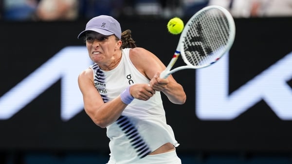 MELBOURNE, AUSTRALIA - JANUARY 19: Iga Swiatek of Poland plays a backhand in the Women's Singles First Round match against Yue Yuan of China during day two of the 2026 Australian Open at Melbourne Park on January 19, 2026 in Melbourne, Australia. (Photo b