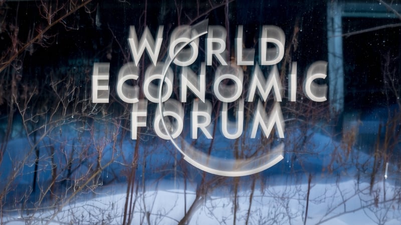 Signage at Davos with snow behind t