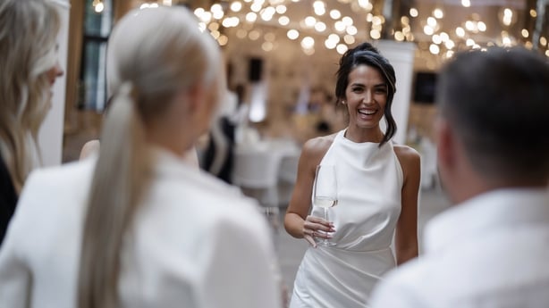 Beautiful bride meeting guests at the wedding party