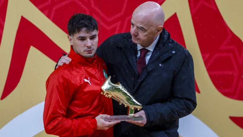 Morocco's forward #10 Brahim Diaz receives the Golden Boot from FIFA President Gianni Infantino during presentation ceremony at the end of the Africa Cup of Nations (CAN) final football match between Senegal and Morocco at the Prince Moulay Abdellah Stadi