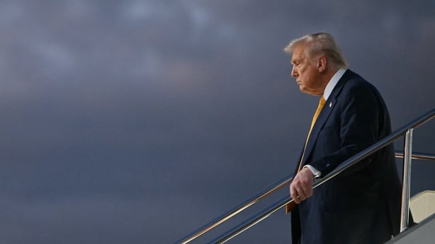 US President Donald Trump alights from Air Force One upon arrival at Haneda Airport in Tokyo on October 27, 2025. Donald Trump arrived in Japan on October 27, the next leg of an Asia tour that could see the US president and China's Xi Jinping end the bruising trade war between the world's largest ec