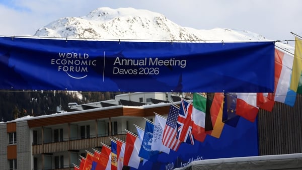 National flags of countries participating in the World Economic Forum (WEF) on display outside the Congress Center in Davos, Switzerland, on Monday, Jan. 19, 2026. The annual Davos gathering of political leaders, top executives and celebrities runs from J