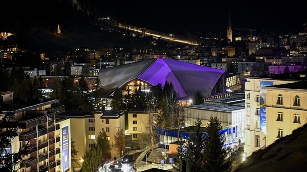 This photograph taken on January 19, 2026, shows a general view of the Congress Centre that hosts the World Economic Forum (WEF) annual meeting and the Alpine resort of Davos by night. The World Economic Forum takes place in Davos