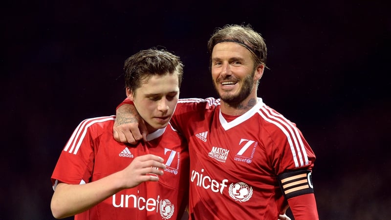 David and Brooklyn Beckham (left) during the UNICEF charity match at Old Trafford, Manchester in 2015. Photo credit: Martin Rickett/PA Wire