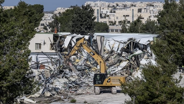 The Israel Land Authority teams accompanied by Israeli police demolish structures at the headquarters of UNRWA in Jerusalem on January 20, 2026. (Photo by Mostafa Alkharouf/Anadolu via Getty Images)