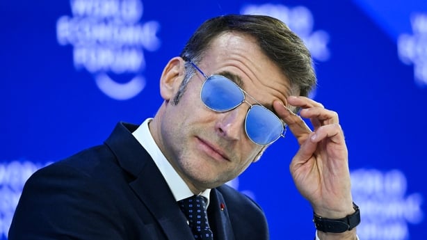 Emmanuel Macron gestures during the World Economic Forum