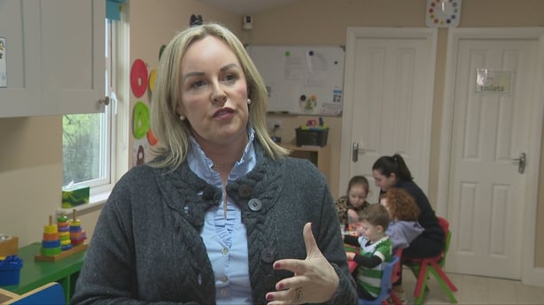 A woman speaks in a childcare facility 