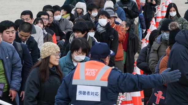 People line up to obtain tickets to observe the court proceedings for the trial of the shooting incident involving former prime minister Shinzo Abe, where the verdict will be handed down at the Nara District Court in Nara, Nara Prefecture on January 21, 2026. (Photo by JIJI Press / AFP) / Japan OUT