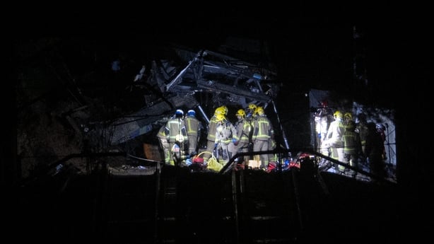 Firefighters and rescue personnel work at the site f the crash in Barcelona