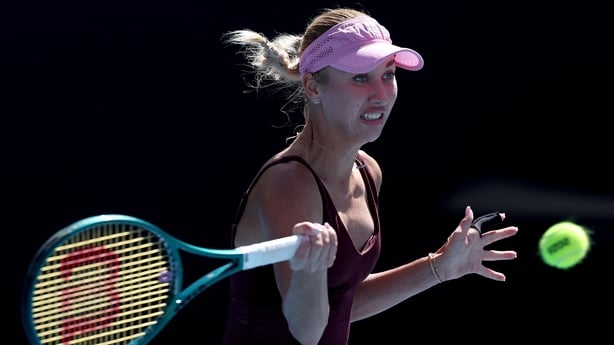 Austria's Anastasia Potapova hits a return to Britain's Emma Raducanu during their women's singles match on day four of the Australian Open tennis tournament in Melbourne on January 21, 2026.