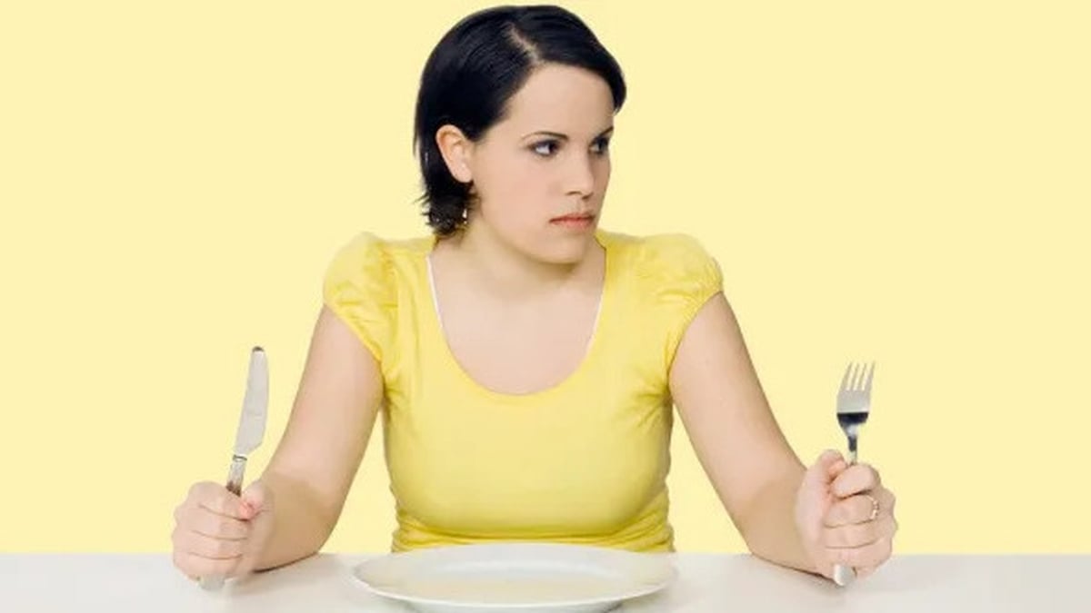 woman at a table waiting for food