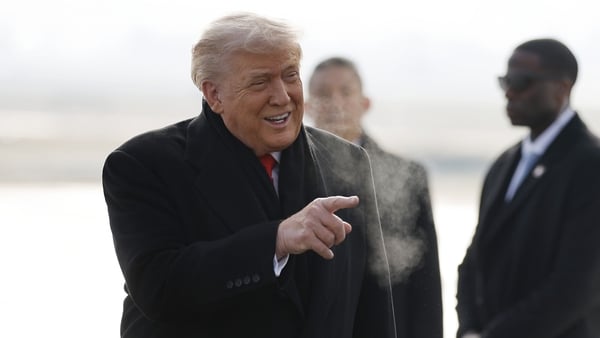 President Donald Trump disembarks Air Force One as he arrives at Zurich Airport