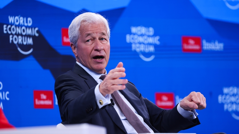 Jamie Dimon at Davos 2026 with WEF signage behind him on a stage