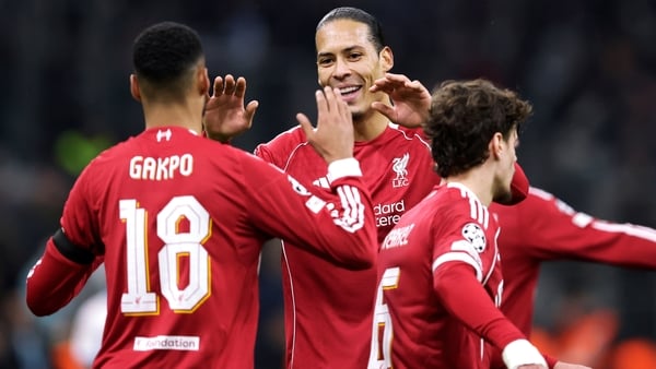 Cody Gakpo, left, celebrates Liverpool's third goal with team-mates Virgil van Dijk and Milos Kerkez
