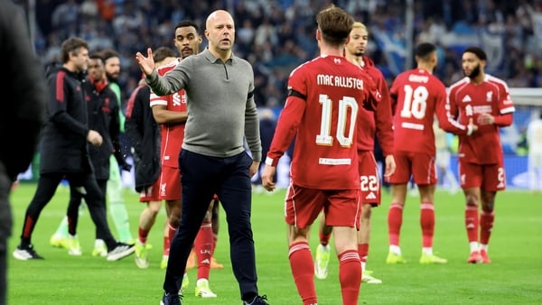 Arne Slot celebrates Liverpool's victory over Marseille with his players at the Stade Velodrome