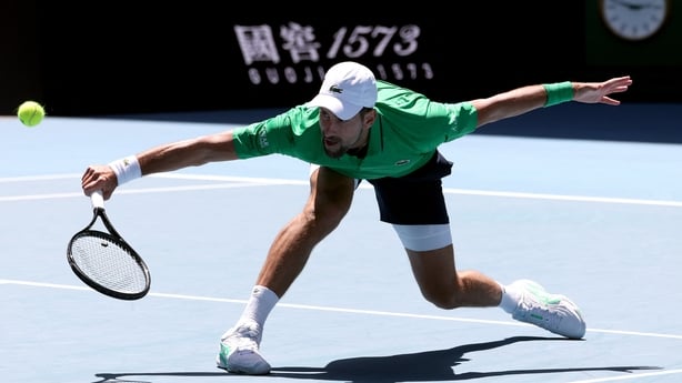 Serbia's Novak Djokovic hits a return to Italy's Francesco Maestrelli during their men's singles match on Day 5 of the Australian Open tennis tournament in Melbourne on January 22, 2026. 