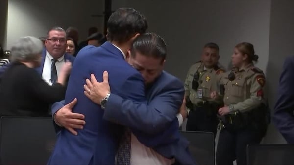 Former Police Officer Adrian Gonzales hugs his defence lawyer after Uvalde acquittal