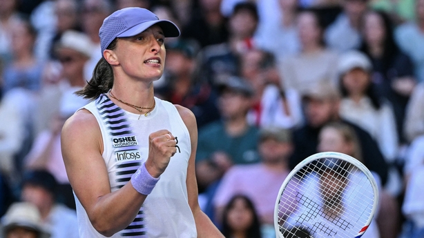 Poland's Iga Swiatek celebrates a match point against Czech Republic's Marie Bouzkova during their women's singles match on day five of the Australian Open tennis tournament in Melbourne on January 22, 2026.