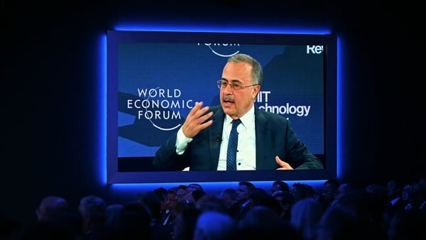 A business man seen on a big screen in Davos at the World Economic Forum