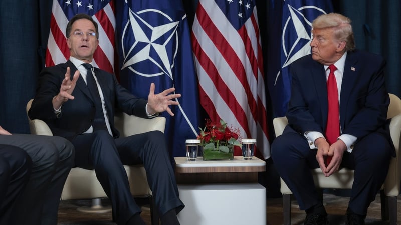 President Donald Trump (R) listens as NATO Secretary General Mark Rutte speaks during a bilateral meeting on the sidelines of the World Economic Forum