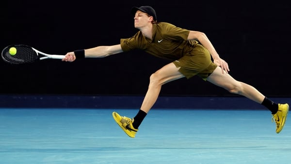 Italy's Jannik Sinner hits a return to Australia's James Duckworth