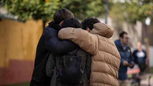 Relatives and neighbours of David Cordon, former international beach football player and fatal victim in the Adamuz train accident, show their grief at the end of a mass celebrated in his name