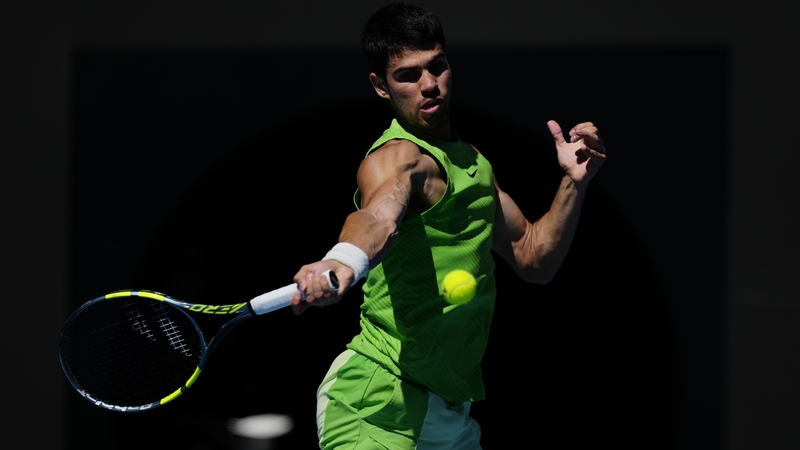 Carlos Alcaraz of Spain plays a forehand against Corentin Moutet of France in the Men's Singles Third Round during day six of the 2026 Australian Open at Melbourne Park on January 23, 2026 in Melbourne, Australia. (Photo by Fred Lee/Getty Images)