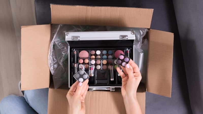 A woman unboxing cosmetics