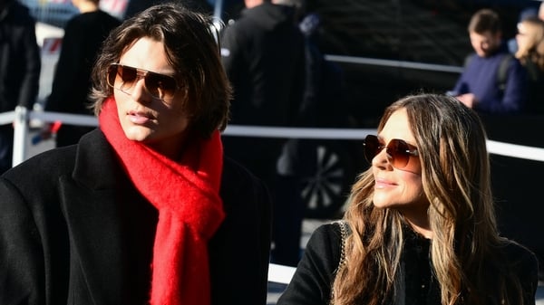 British actress and model Liz Hurley (R) and her son Damian Hurley arrive at the funeral ceremony for the late Italian fashion designer Valentino Gavarani at the Basilic of Santa Maria degli Angeli e dei Martiri, in Rome on January 23, 2026. (Photo by Ste