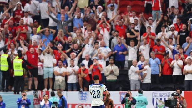 AL KHOR, QATAR - DECEMBER 10: Fans of England applaud a dejected Jude Bellingham of England after being knocked out during the FIFA World Cup Qatar 2022 quarter final match between England and France at Al Bayt Stadium on December 10, 2022 in Al Khor, Qatar. (Photo by Robbie Jay Barratt - AMA/Getty 