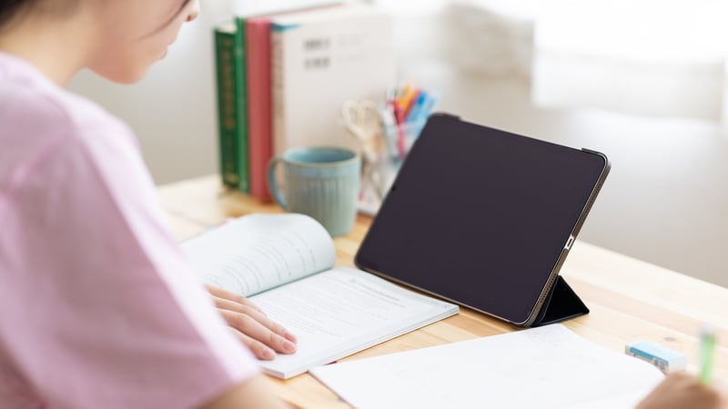 Close up image of teenager students studying in group on classroom desk