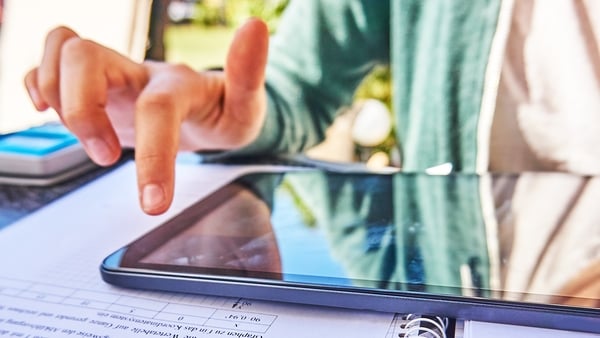 Close up image of teenager students studying in group on classroom desk