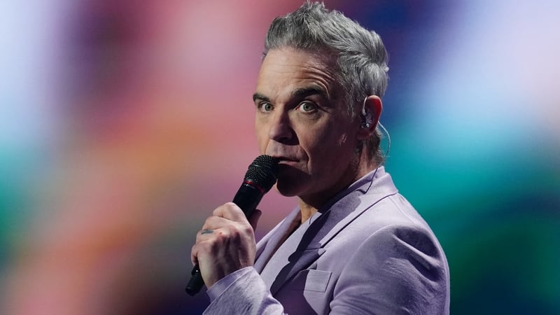 Robbie Williams performs on stage during the draw for the 2026 FIFA Football World Cup taking place in the US, Canada and Mexico, at the Kennedy Center, in Washington, DC, on 5 December, 2025