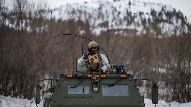 US soldier sits on a M142 High Mobility Artillery Rocket System during a military exercise in 2024, in Alta, above the Arctic Circle in Norway.