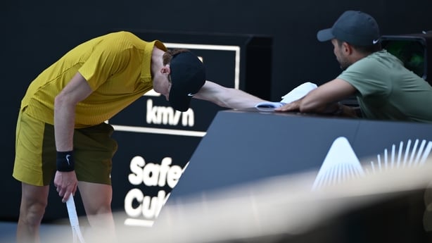 Jannik Sinner of Italy talks with his team members in the Men's Singles Third Round against Eliot Spizzirri of the United States during day seven of the 2026 Australian Open at Melbourne Park on January 24, 2026 in Melbourne, Australia. (Photo by Hannah Peters/Getty Images)