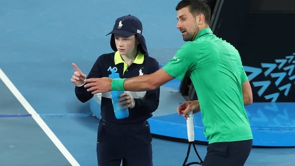 Serbia's Novak Djokovic talks to a ball kid during the men's singles match against Netherlands' Botic van de Zandschulp on day seven of the Australian Open tennis tournament in Melbourne on January 24, 2026. (Photo by DAVID GRAY / AFP) / -- IMAGE RESTRICT