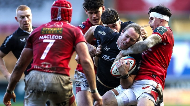 24 January 2026; Werner Kok of Ulster is tackled by Tom Rogers of Scarlets during the United Rugby Championship match between Scarlets and Ulster at Parc Y Scarlets in Llanelli, Wales. Photo by Chris Fairweather/Sportsfile