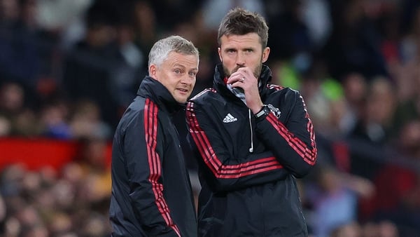 MANCHESTER, ENGLAND - SEPTEMBER 22: Ole Gunnar Solskjaer the manager of Manchester United and his assistant Michael Carrick look on during the Carabao Cup Third Round match between Manchester United and West Ham United at Old Trafford on September 22, 202