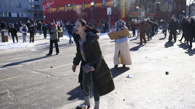Protesters confornt federal agents after the fatal shooting of Alex Pretti