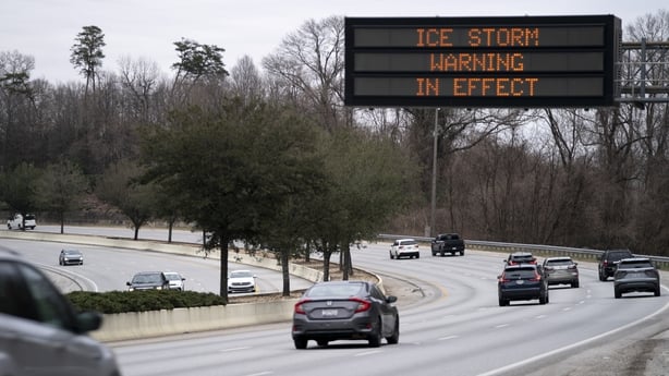 A road sign that reads "Ice Storm Warning In Effect" 