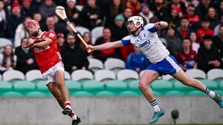25 January 2026; William Buckley of Cork scores a point despite the attention of Shane Bennett of Waterford during the Allianz Hurling League Division 1A match between Cork and Waterford at SuperValu Páirc Uí Chaoimh in Cork. Photo by Ben McShane/Sportsfi