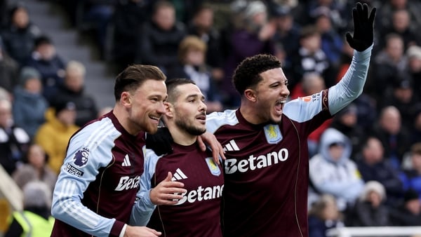Aston Villa's Emi Buendia with Matty Cash and Jadon Sancho during the Premier League match between Newcastle United and Aston Villa at St James' Park on January 25, 2026 in Newcastle upon Tyne, England.